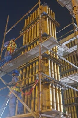 Column formwork with crew at night